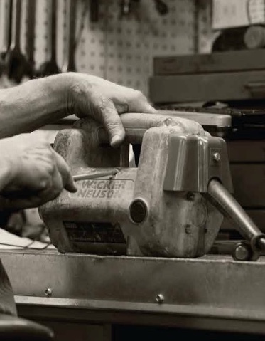 industrial tool repair: close-up of hands of person repairing industrial pump