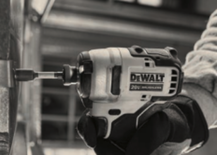 man holding tool vendor dewalt drill